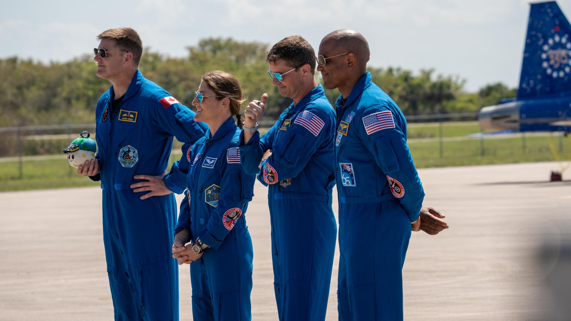 These images show the moments shortly after the arrival of the Artemis II crew to NASA’s Kennedy Space Center on March 27, 2026 ahead of the launch. The four astronauts, Victor Glover, Reid Wiseman, Christina Koch, and Jeremy Hansen, arrived on a T38, which can be seen behind them. They took turns speaking to the crowd as they also announced the zero-gravity indicator they would be taking with them on their journey.